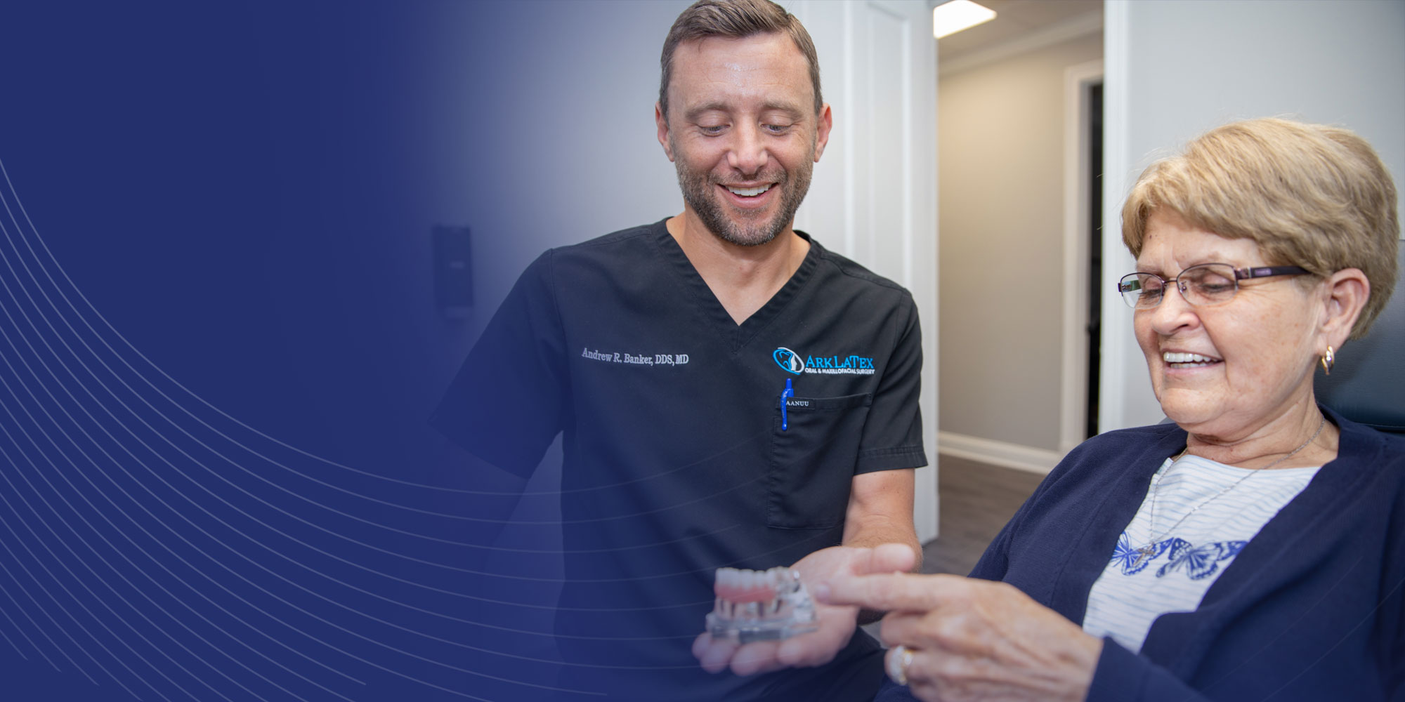 banker with dental patient showing implants